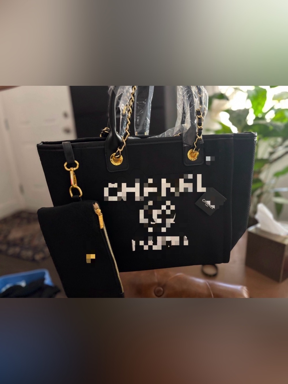 Elegant Black Tote with Gold Chain Accents